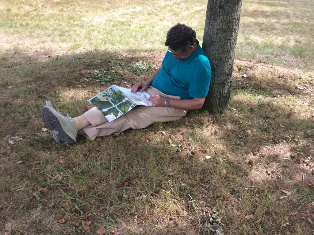 Bill trying to read map but a sleep overtakes him after a long day of signtseeing