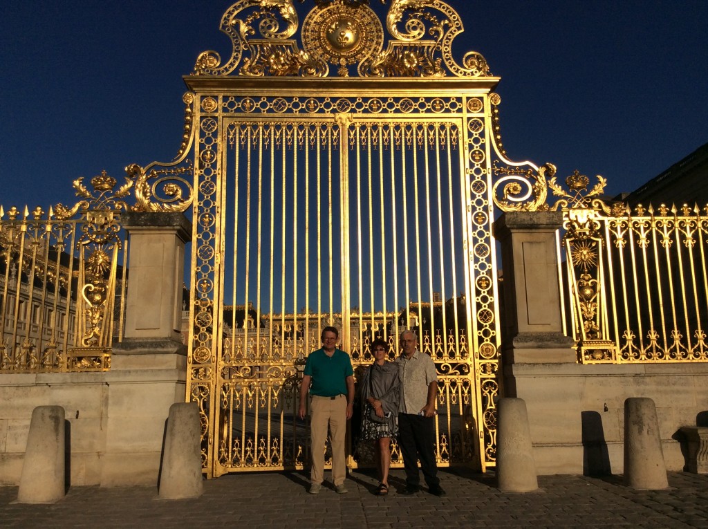 Kirk, Marcy and Bill at the entry gates to the chateau of Versailles